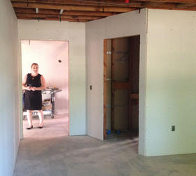 SAY's Communications Director, Caitlin Childs, inspects a future residential room at the agency's emerging Dream Center in southeast Santa Rosa.